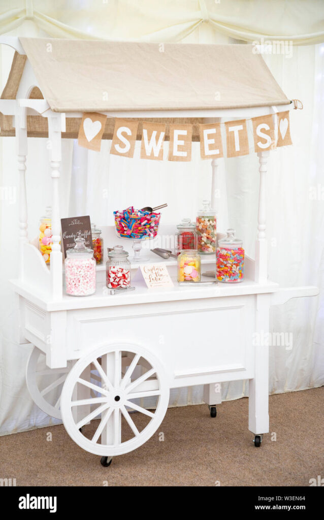     Elegant sweet cart for wedding hire filled with sweets at a wedding reception